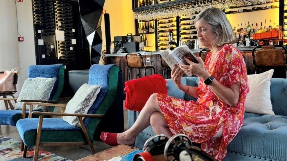 Natalie Turner reads The Red Silk Dress in the lounge at Howard’s Folly, Estremoz, ahead of the Red Silk Salon on Saturday 26 September.
