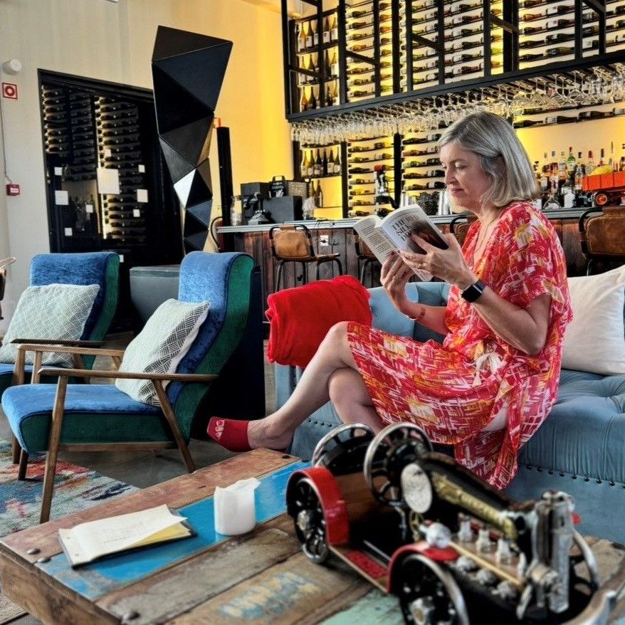 Natalie Turner reads The Red Silk Dress in the lounge at Howard’s Folly, Estremoz, ahead of the Red Silk Salon on Saturday 26 September.