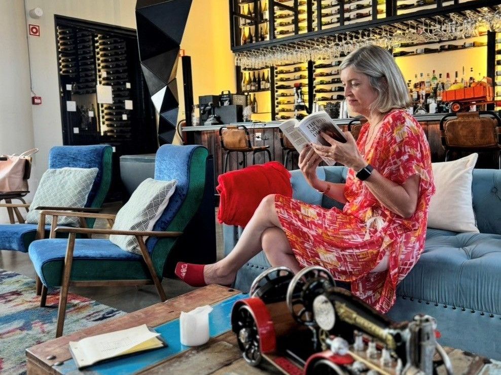 Natalie Turner reads The Red Silk Dress in the lounge at Howard’s Folly, Estremoz, ahead of the Red Silk Salon on Saturday 26 September.