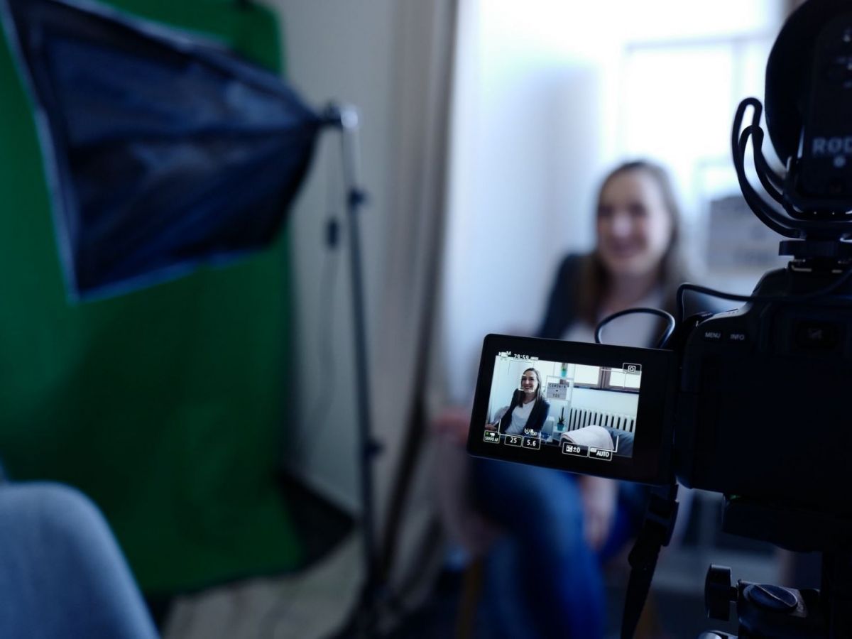 Woman sitting in front of camera